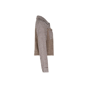 Detail of brown plaid cropped jacket showing the woven fabric texture and lapel collar