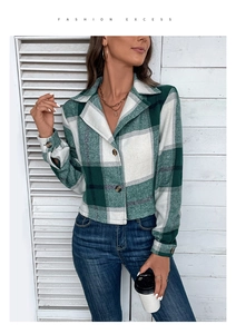 Close-up of green and white plaid cropped jacket with lapel collar and buttons