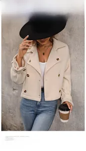 Detail of short beige wool coat featuring stylish lapel and dark tortoiseshell buttons