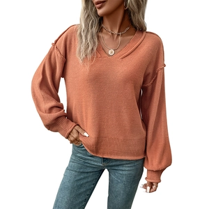 Pull en maille orange à col en V avec manches lanterne et coupe décontractée
