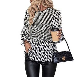 Slim fit black and white striped shirt with smocked chest and tiered ruffle details