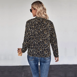Women's leopard print long sleeve shirt featuring a loose fit and stylish back view