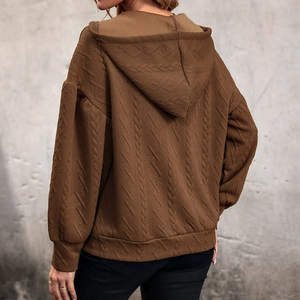 Brown knit hoodie for women with textured geometric patterns and dropped shoulders