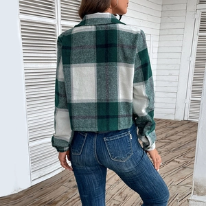 Back view of women's cropped plaid shirt in dark green and white flannel with collar