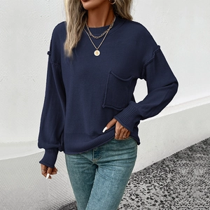 Navy blue crew neck knit sweater with pocket and raw edge detail for women