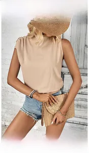 Close-up of beige sleeveless pleated top with textured fabric for a summer casual look