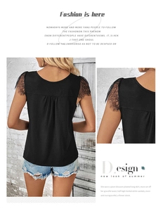 Detailed view of the eyelash lace sleeves and pleated back on a black summer V-neck top