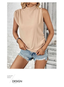 Detail of elegant beige sleeveless top featuring sophisticated shoulder pleats and chic high neck