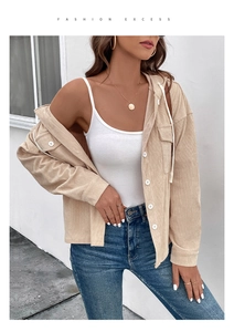 Detail of beige corduroy hooded jacket with chest flap pockets and white drawstring
