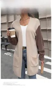Close-up of color-block knit cardigan featuring large side pockets and thick texture