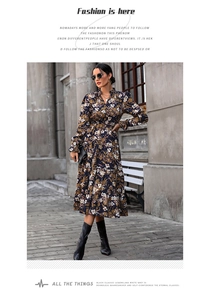 Detail of V-neck floral midi dress with ruffle cuffs and a tiered cake-style skirt hem