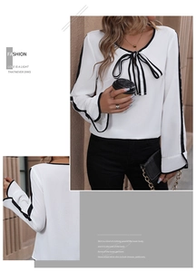 Detail of white long sleeve blouse featuring black contrast piping and elegant bow tie neck
