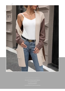 Detail of long-sleeved color-block knit cardigan with patch pockets and soft texture