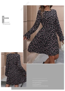 Detail of black floral chiffon dress showing long sleeves and high waist cinched design