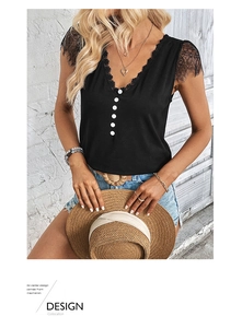 Detailed view of the V-neckline with black eyelash lace trim and white button accents