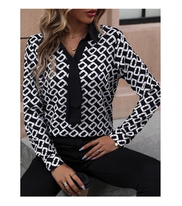 Detail of long sleeve shirt with black and white geometric chain print and pointed collar