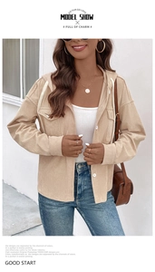 Detail view of beige corduroy hooded jacket with drawstring, chest pockets and button-up closure