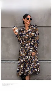 Detail of V-neck floral print long sleeve maxi dress with ruffled collar and elastic cuffs