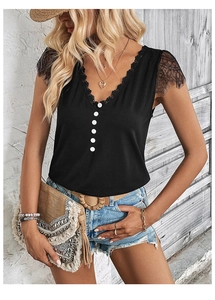 Detail of V-neckline featuring delicate eyelash lace trim and white decorative buttons