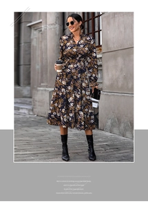 Detail view of the floral print tiered skirt and long sleeves with ruffled collar stand