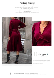 Close-up of velvet fabric texture and ruffle details on wine red evening dress