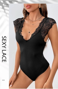 Detail of elegant black lace V-neck bodysuit featuring fine ribbed fabric and floral trim
