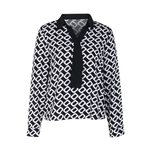 Detail of long sleeve chiffon shirt featuring black and white geometric chain print and tie neck