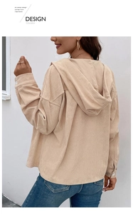Back view of apricot corduroy hooded jacket showing texture and loose silhouette