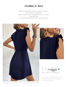 Detail view of navy sleeveless dress with ruffle shoulders and a matching waist belt