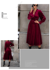 Detail of burgundy velvet dress featuring elegant ruffles and a deep V-neckline