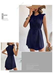 Detail view of navy sleeveless dress with ruffle stand collar and waist tie design