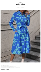 Detail of A-line floral shirt dress with waist belt and classic lapel collar