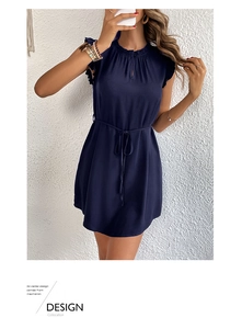 Detail view of navy sleeveless dress featuring ruffle collar and adjustable waist drawstring