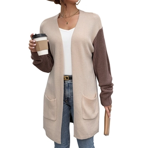 Women's long knit cardigan with contrast color sleeves and functional pockets