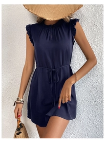 Detail of navy blue sleeveless dress featuring ruffle shoulders and adjustable waist tie