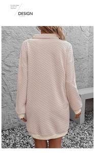 Detail showing pink quilted texture with diamond pattern and cream ribbed cuffs