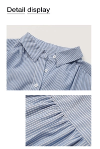 Détail du col à revers et des boutons blancs sur la chemise à rayures bleues et tissu