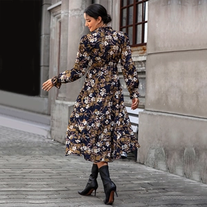 Floral print long sleeve dress in navy blue with layered ruffle hem and stylish ankle boots