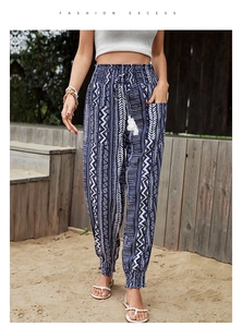 Detailed view of high waist smocked pants with ethnic print and tassel drawstrings