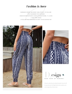 Detail of high waist bohemian print pants with blue and white geometric patterns