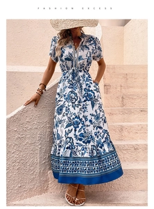Detail of V-neckline with white lace trim and blue floral print on summer maxi dress