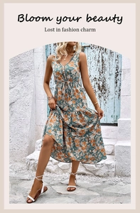 Detail of V-neck sleeveless floral summer dress with drawstring waist and tiered hem