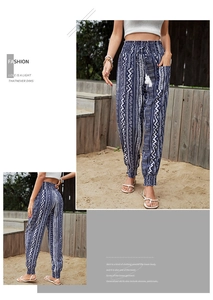 Detail of high waisted bohemian print trousers with drawstring waist and elastic cuffs