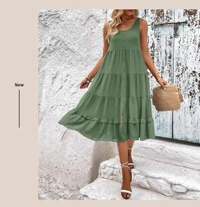 Detail of green sleeveless tiered dress with button-down front in bohemian style