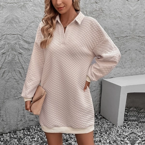 Chic cream quilted polo neck mini dress with long sleeves and textured geometric pattern