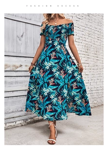 Detail of off-shoulder floral maxi dress with tropical print and smocked waist design