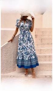 Detail of blue floral print maxi dress with V-neck and elastic waist for vacation