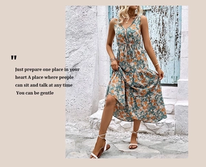 Detail of V-neck floral summer maxi dress with orange and blue prints in Mediterranean style