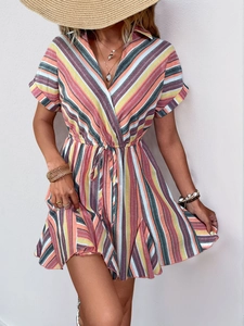 Close-up detail of multi-color striped V-neck summer dress with waist tie and ruffles