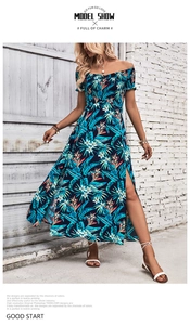 Detail of off-shoulder tropical floral maxi dress with side slits and vibrant leaf pattern